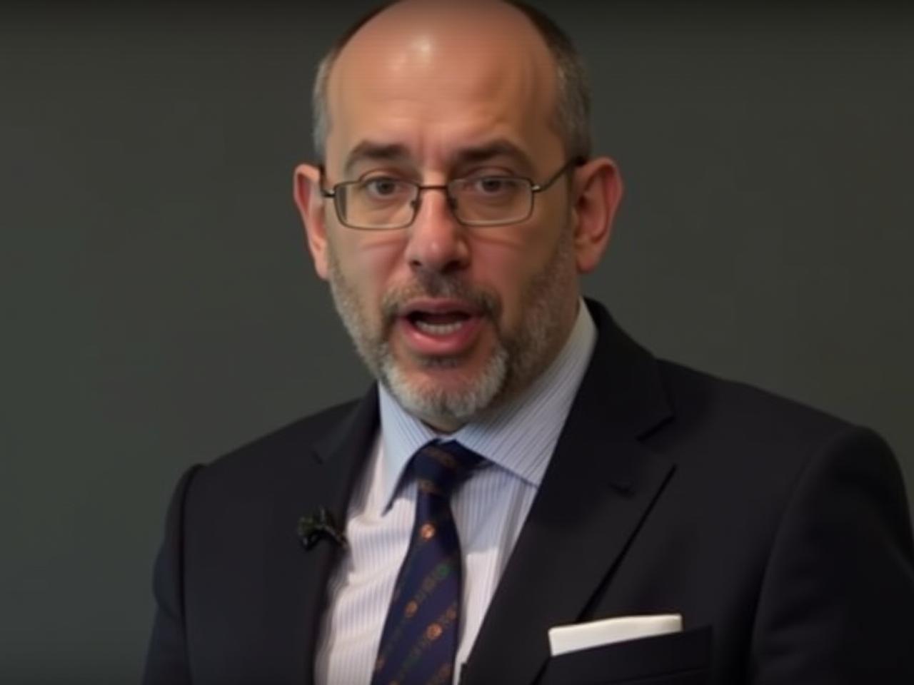 Noam Aviry, fundraising expert, speaking passionately about emotional intelligence in fundraising, with a focused gaze and empathetic expression.